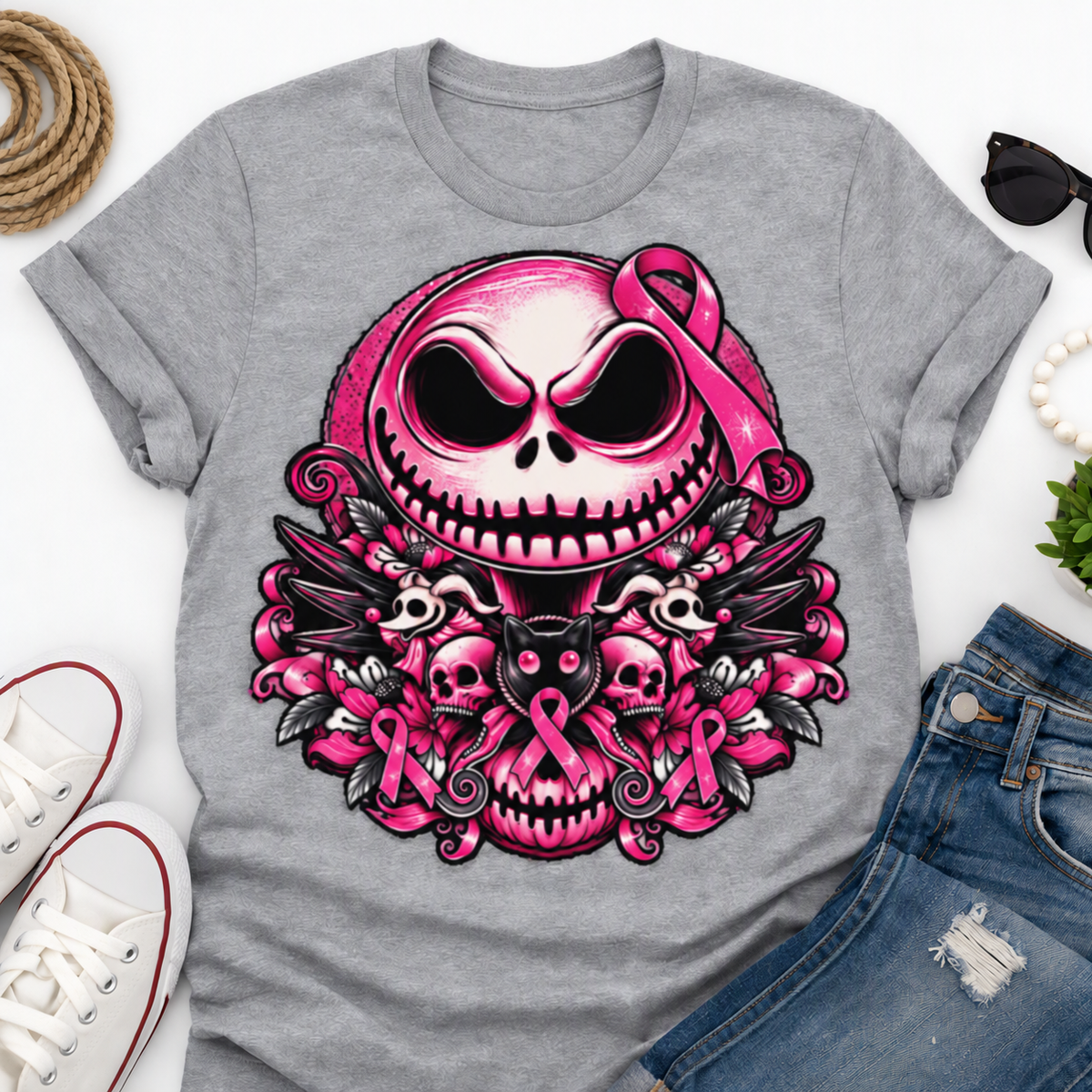 Heather-gray shirt with pink skull, ribbons, flowers, and winged skull artwork